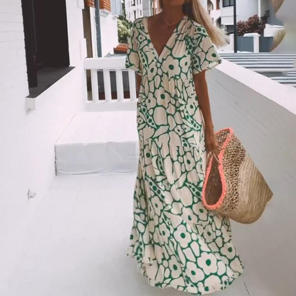 Juni - Ibiza-stil klänning med bohemiskt blomtryck